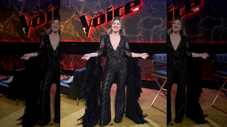 Kelly Clarkson showing off a sparkling, low-cut jumpsuit before her May 2025 performance on "The Voice"