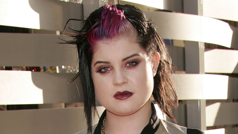 Kelly Osbourne with dark hair and dark lipstick