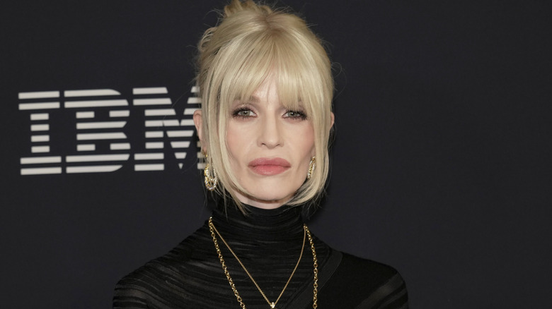 image of Kelly Osbourne looking into the camera straight-faced at an event