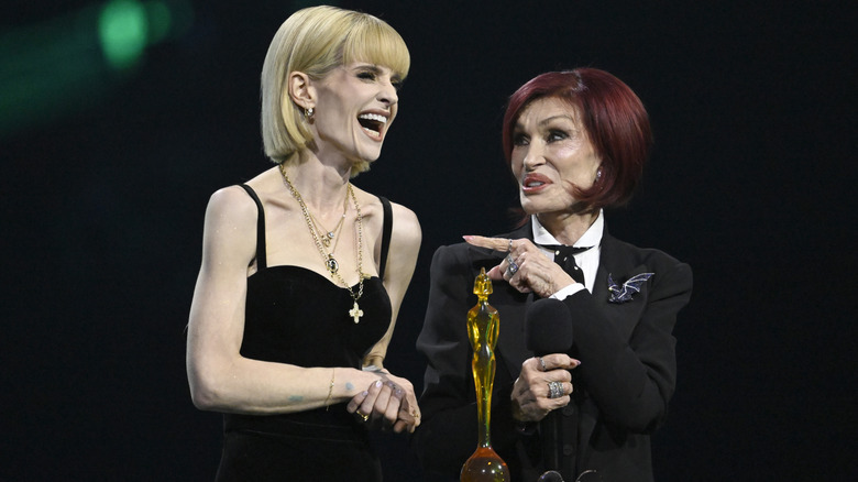 Kelly and Sharon Osbourne cracking jokes onstage at the 2026 BRIT Awards