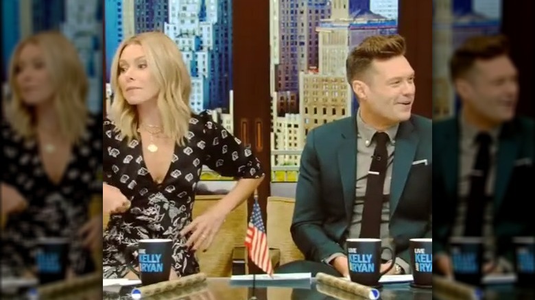 Kelly Rupa adjusting bra on TV