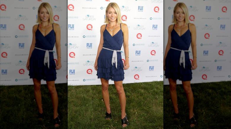Kelly Ripa wearing a blue minidress with a tiered ruffled skirt