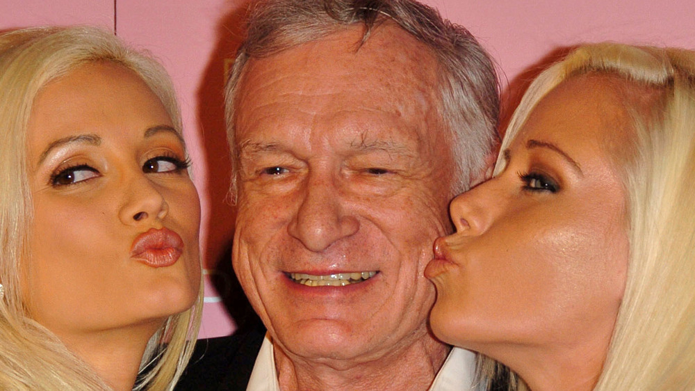 Holly Madison and Kendra Wilkinson kiss Hugh Hefner