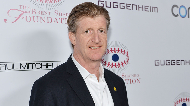 Patrick J. Kennedy smiling on step-and-repeat