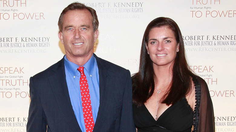 Robert F. Kennedy Jr. and Mary Richardson Kennedy smiling on step-and-repeat