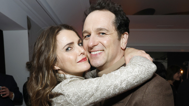 Keri Russell posing with arms around Matthew Rhys