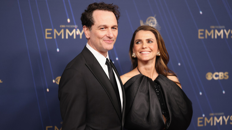 Matthew Rhys and Keri Russell posing at the 77th Primetime Emmy Awards