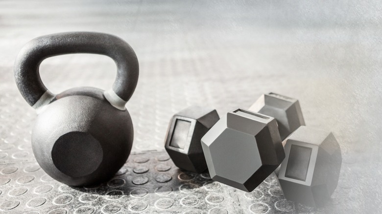 Kettlebell and dumbbells on floor