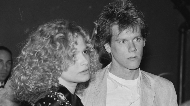 Kevin Bacon and Kyra Sedgwick in a black and white photo from 1987
