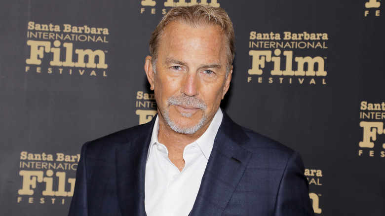 Kevin Costner posing for photos