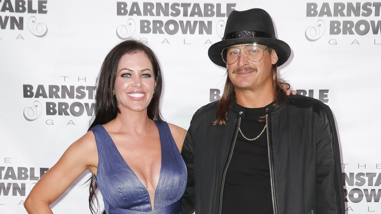 Audrey Berry and Kid Rock smiling for photos