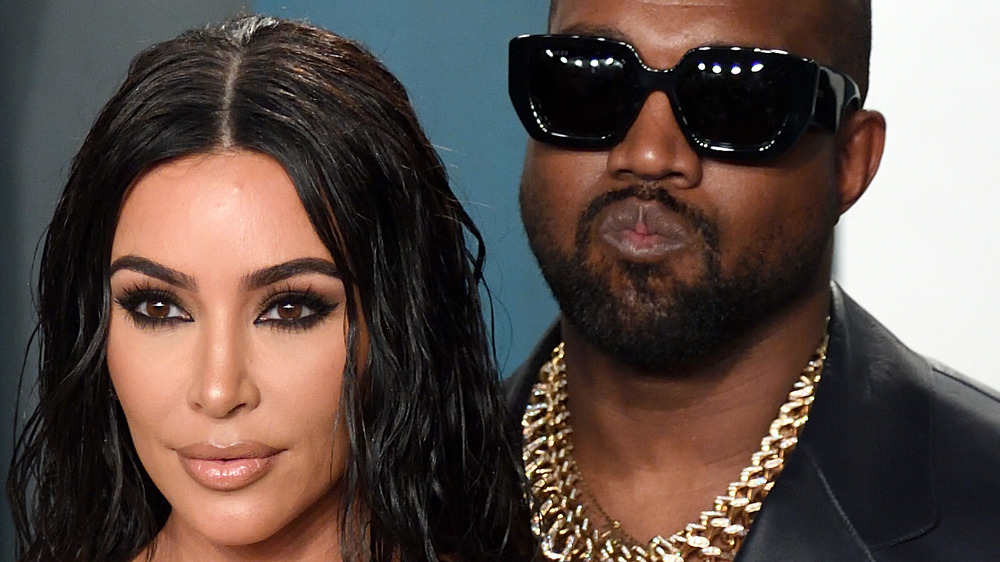 Kim Kardashian poses with Kanye West