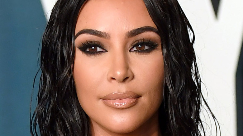 Kim Kardashian poses on the red carpet