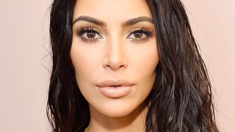 Kim Kardashian with serious expression and nude lipstick