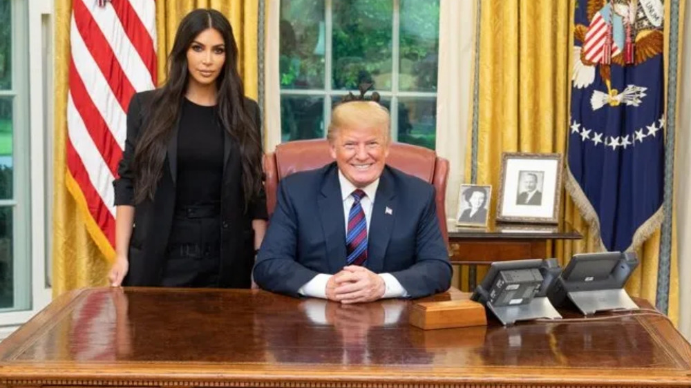 Kim Kardashian, Donald Trump posing in the Oval Office
