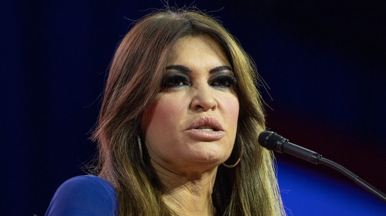 Kimberly Guilfoyle speaking in a blue dress while at a CPAC.