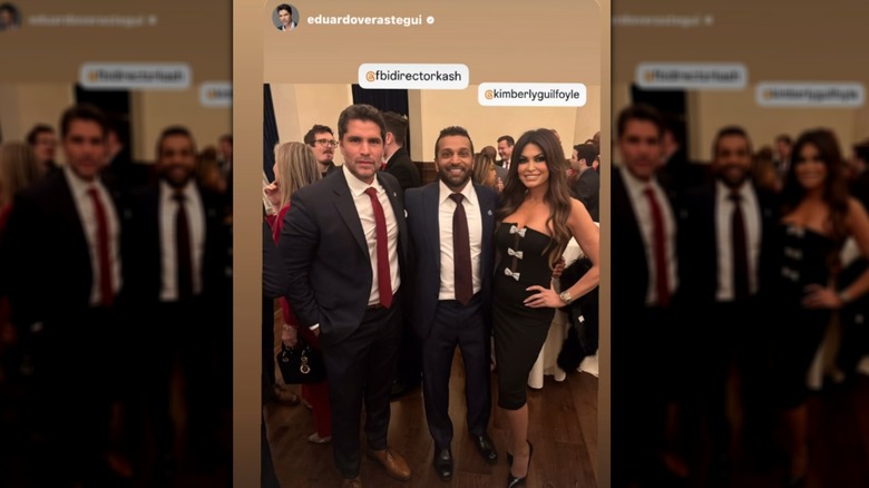Kimberly Guilfoyle smiling ina  black dress next to Kash Patel and Eduardo Verástegui.