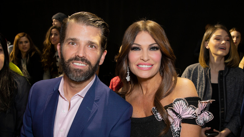 Donald Trump Jr. and Kimberly Guilfoyle smile for the camera
