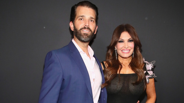 Kimberly Guilfoyle and Donald Trump Jr. pose backstage for Zang Toi fashion show during New York Fashion Week on February 13, 2019 in New York City