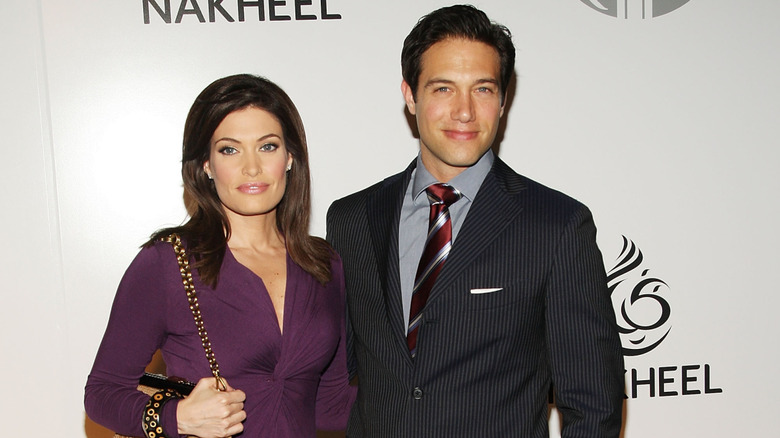 Kimberly Guilfoyle and Eric Villency posing for photos