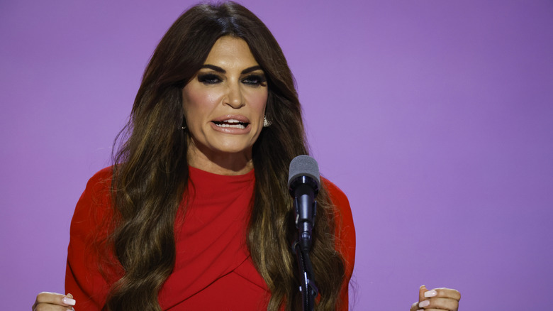 Kimberly Guilfoyle looking angry while speaking into a microphone.