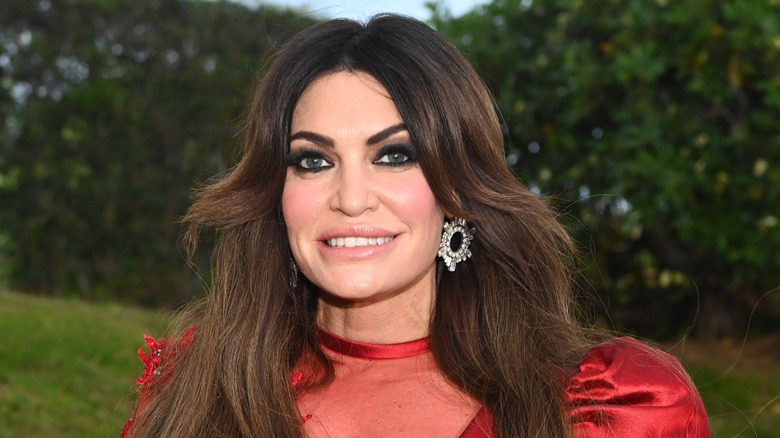Kimberly Guilfoyle wearing red dress with puffy sleeves
