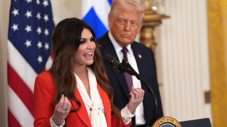 Kimberly Guilfoyle smiling in the middle of a group