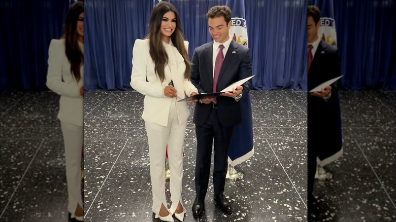 Kimberly Guilfoyle smiling and standing next to her son, Ronan Villency