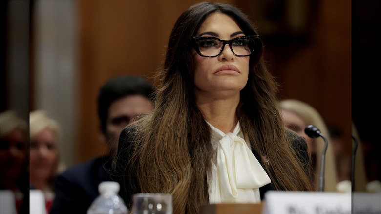 Kimberly Guilfoyle frowning in glasses