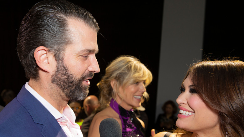 Kimberly Guilfoyle smiling at Donald Trump Jr.