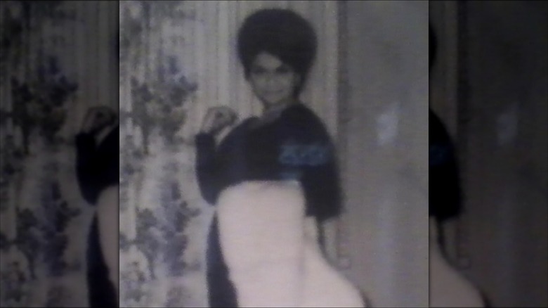 Mercedes Guilfoyle smiling with a beehive hairdo