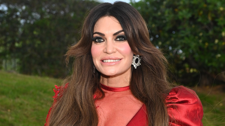 Kimberly Guilfoyle outdoors red dress