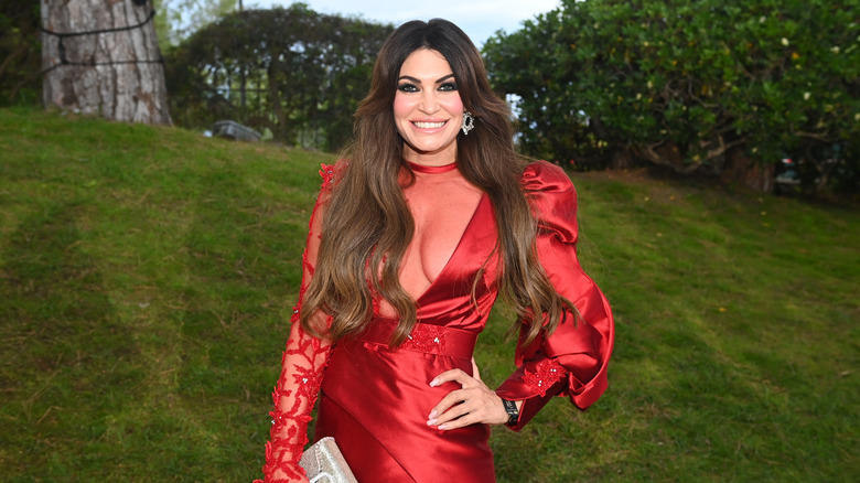 Kimberly Guilfoyle poses in a red dress