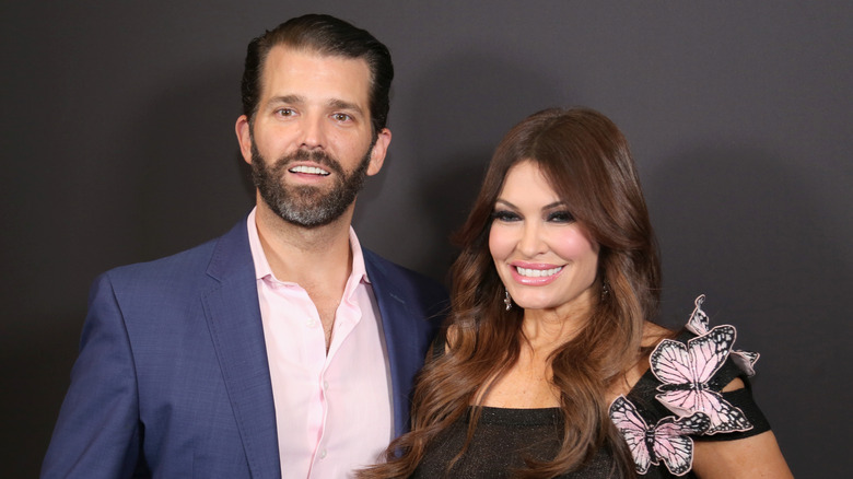Kimberly Guilfoyle and Don Jr. posing for photos together