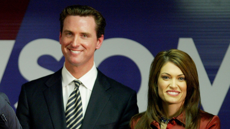 Gavin Newsom and Kimberly Guilfoyle smiling at an event