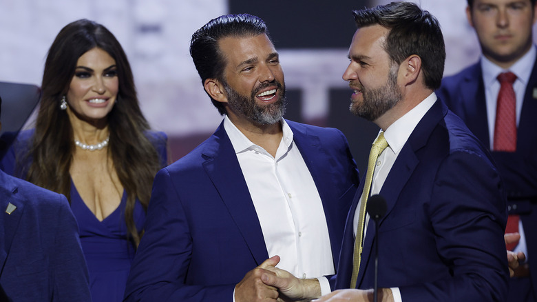 Kimberly Guilfoyle watching Donald Trump Jr. and JD Vance shake hands