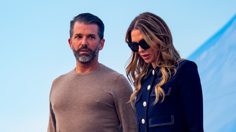 Donald Trump Jr. and Bettina Anderson exit a plane