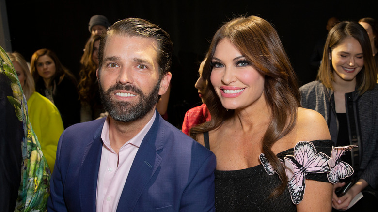 Donald Trump Jr. and Kimberly Guilfoyle smiling during New York Fashion Week