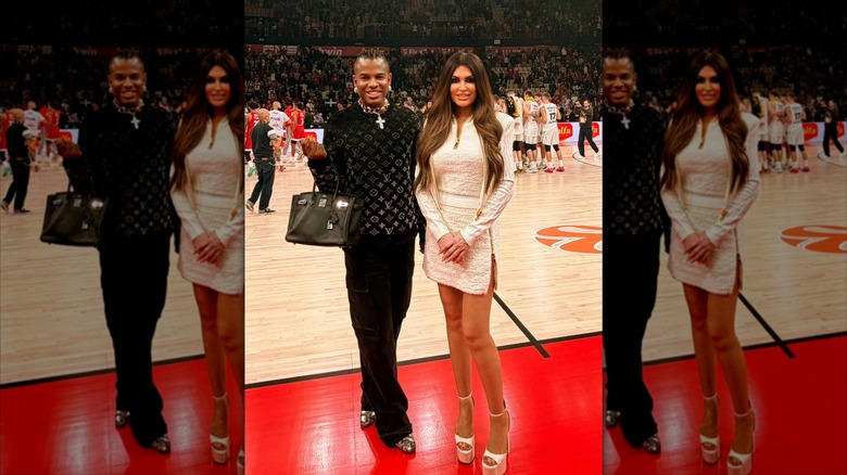 Kimberly Guifoyle in an all-white outfit on the sidelines of a basketball game.