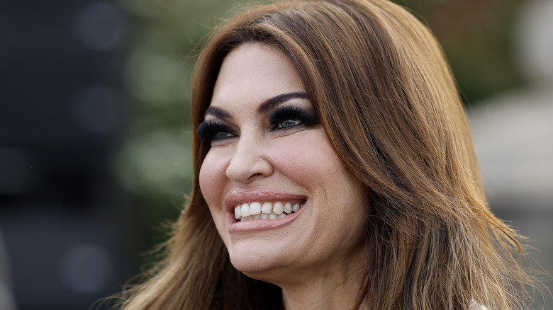 Close up from low angle of side profile of Kimberly Guilfoyle with heavy lashes.