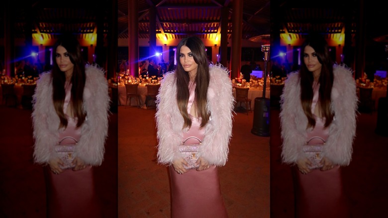 Kimberly Guilfoyle posing pink fur coat and dress