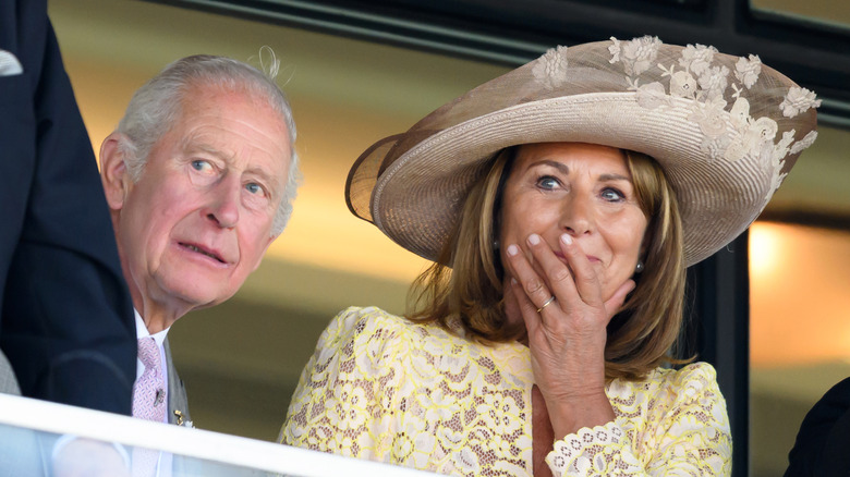 King Charles III and Carole Middleton looking in the distance