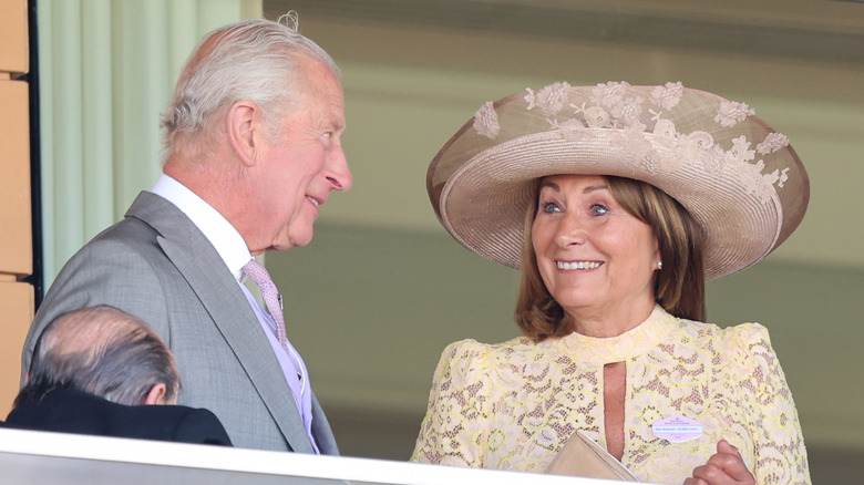 King Charles III talking to Carole Middleton