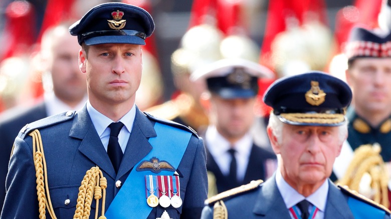 Prince William King Charles III frowning