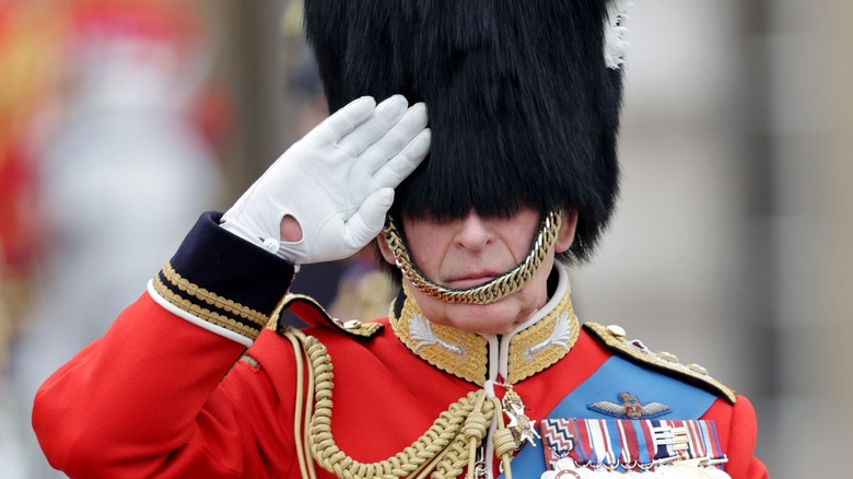 King Charles III saluting