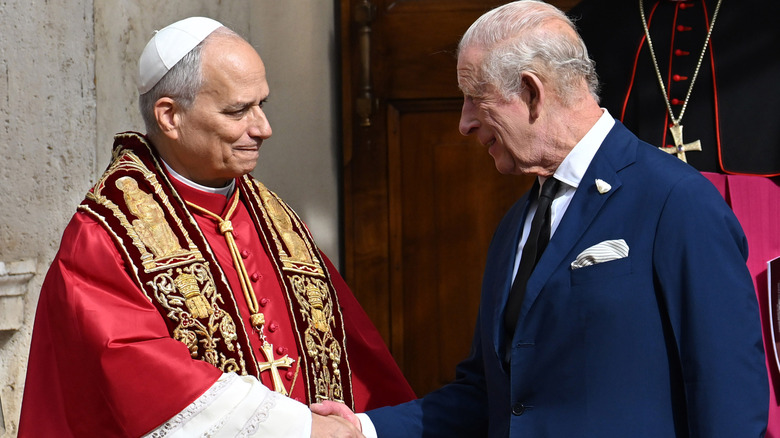 Pope Leo XIV shaking hands with King Charles III