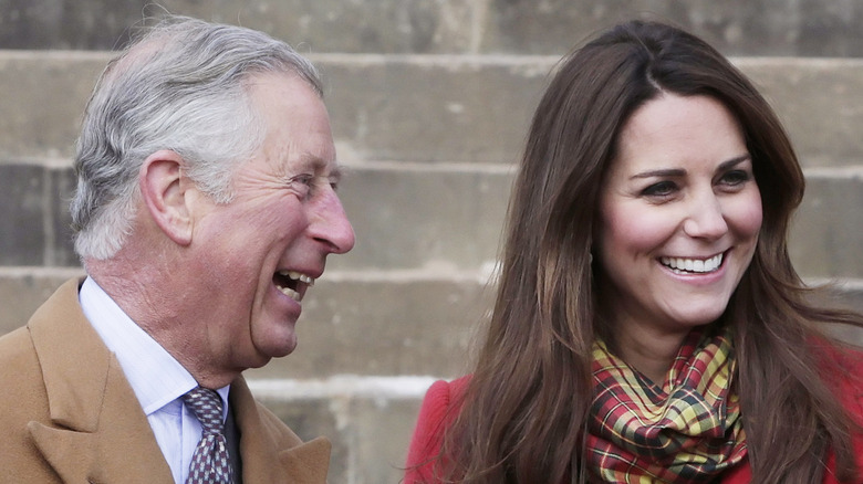 King Charles and kate middleton smiling 