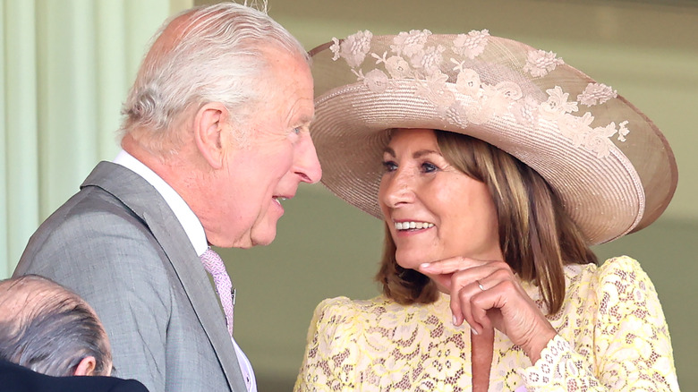 King Charles II and Carole Middleton talking and smiling