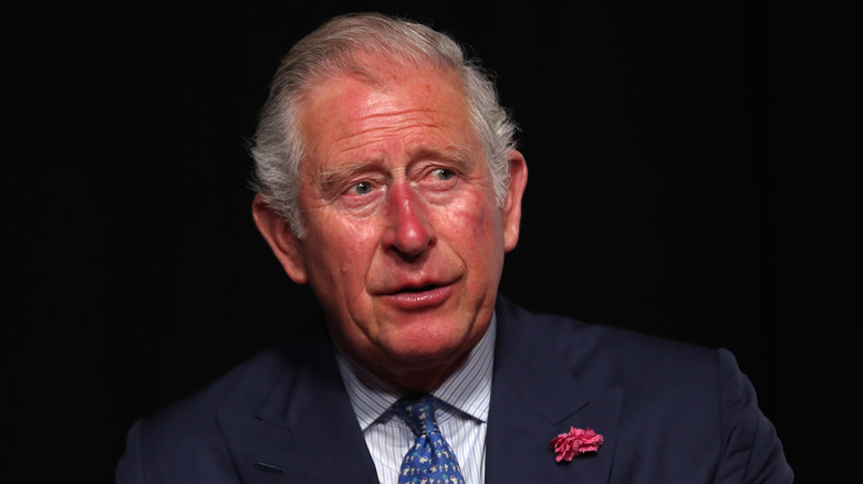 King Charles III looking very red