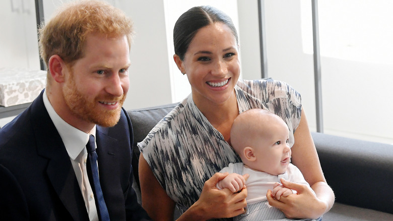 Prince Harry, Meghan Markle, and Prince Archie smile together
